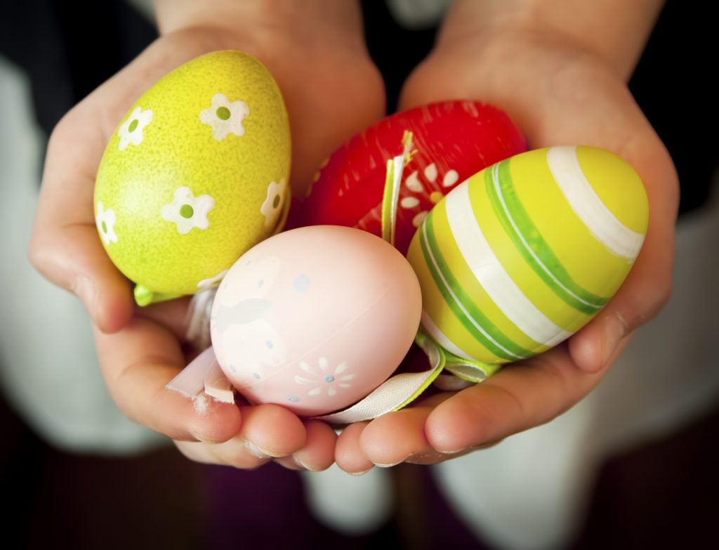 Child Hands Holding Colorful Easter Eggs